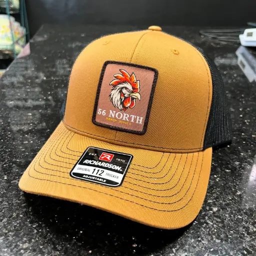 56 North Baseball Hat - Rooster Patch
